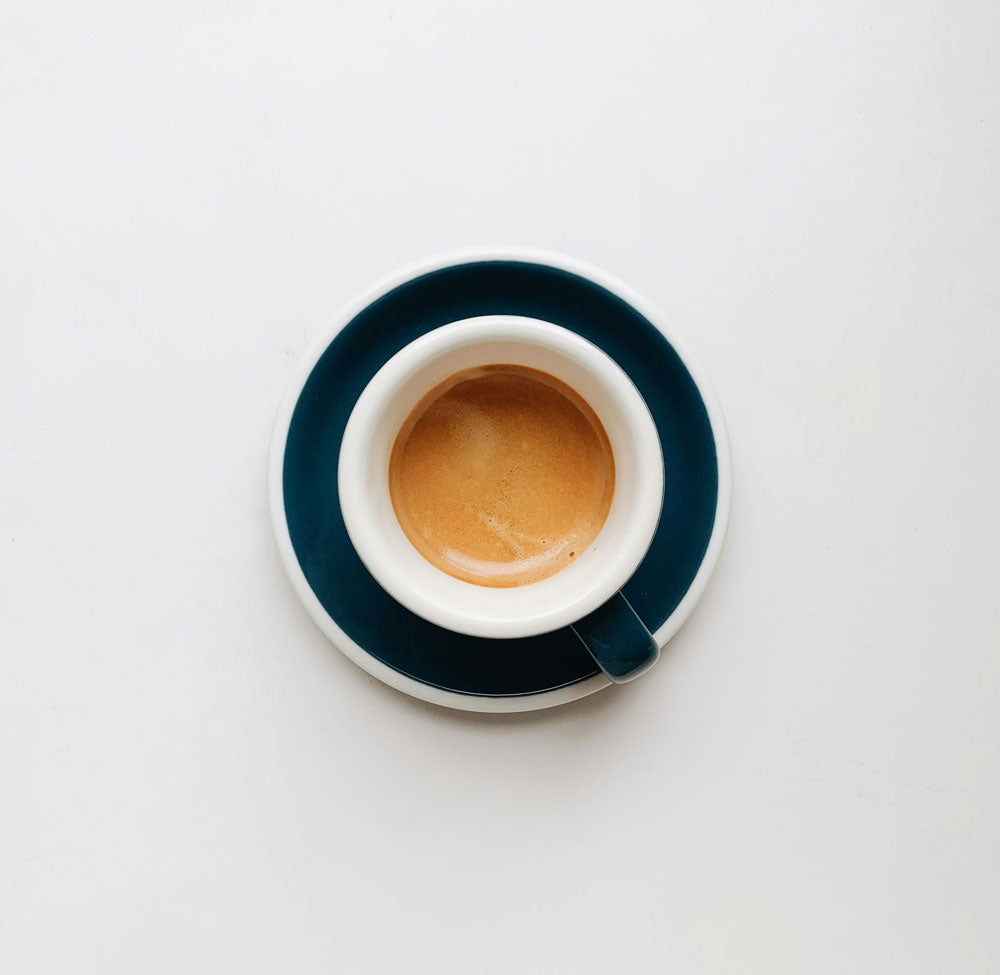 Shot of espresso in a white cup