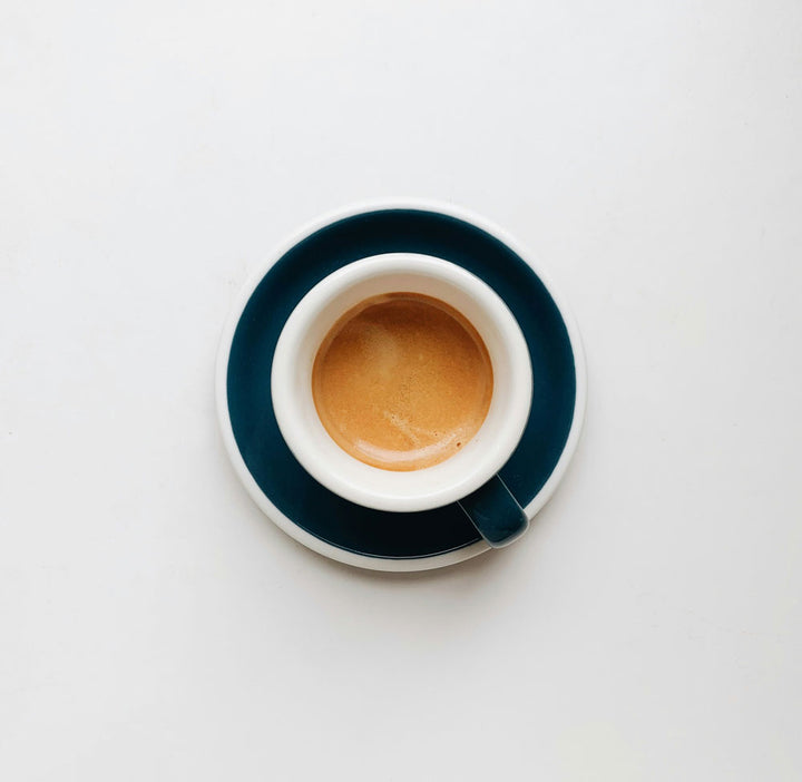 Shot of espresso in a white cup